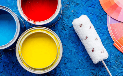 paint cans and a roll of paint